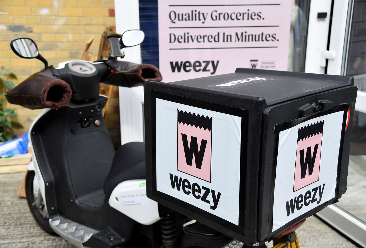 An electric delivery bicycle is parked at the Lambeth depot of online supermarket Weezy, amidst the expansion of rapid grocery delivery firms, London, Britain, May 12, 2021. Picture taken May 12, 2021. REUTERS/Toby Melville