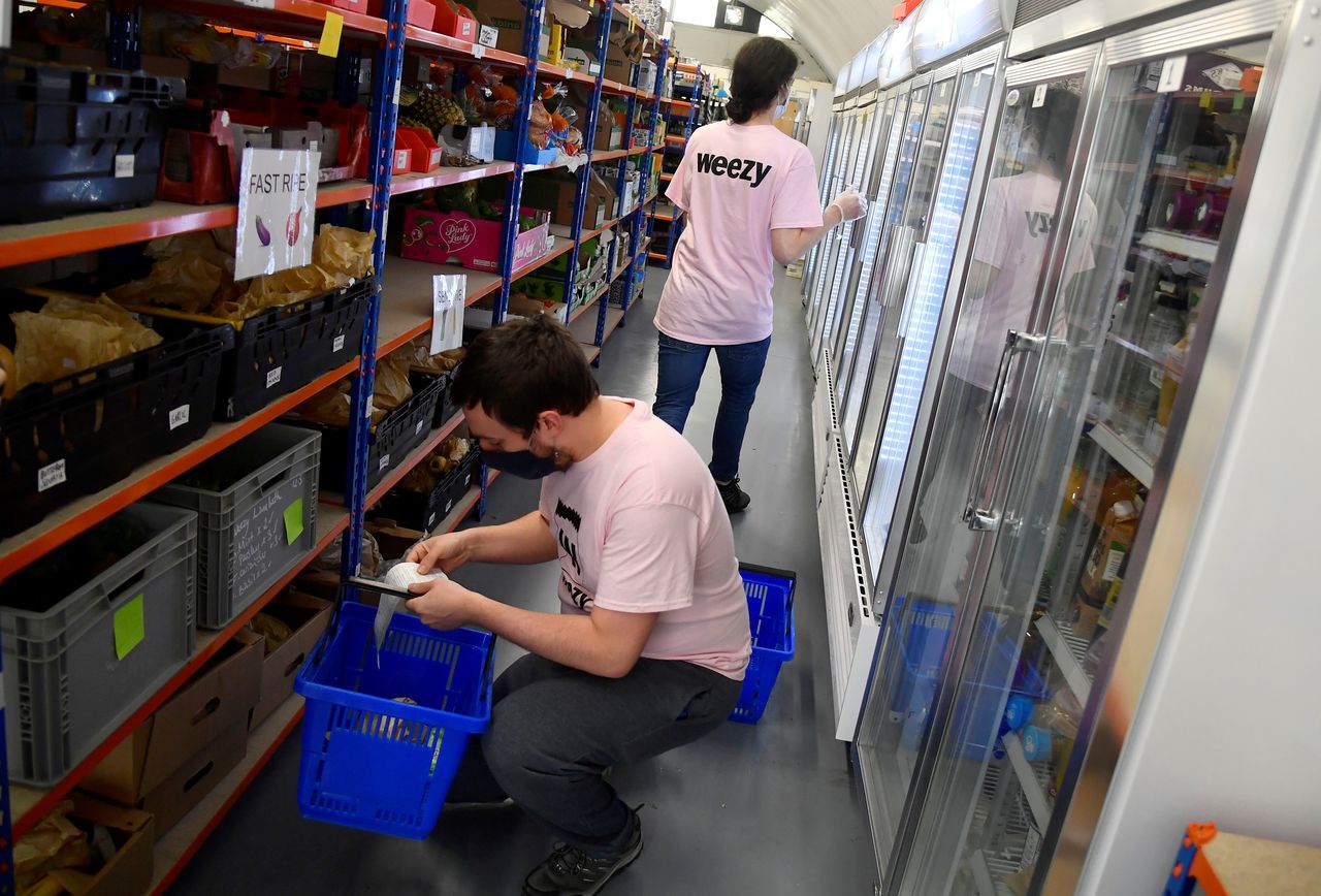 Pickers from online supermarket Weezy prepare orders at the Lambeth depot, amidst the expansion of rapid grocery delivery firms, London, Britain, May 12, 2021. Picture taken May 12, 2021. REUTERS/Toby Melville