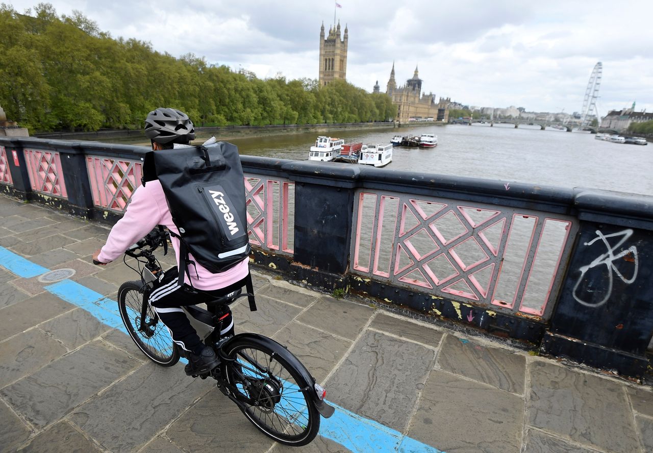 A rider from online supermarket Weezy delivers an order amidst the expansion of rapid grocery delivery firms, London, Britain, May 12, 2021. Picture taken May 12, 2021. REUTERS/Toby Melville