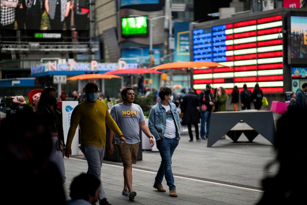 FILE PHOTO: People make their way through Times Square, amid the coronavirus disease (COVID-19) pandemic, in Manhattan, New York City, U.S., May 07, 2021. REUTERS/Eduardo Munoz/File Photo