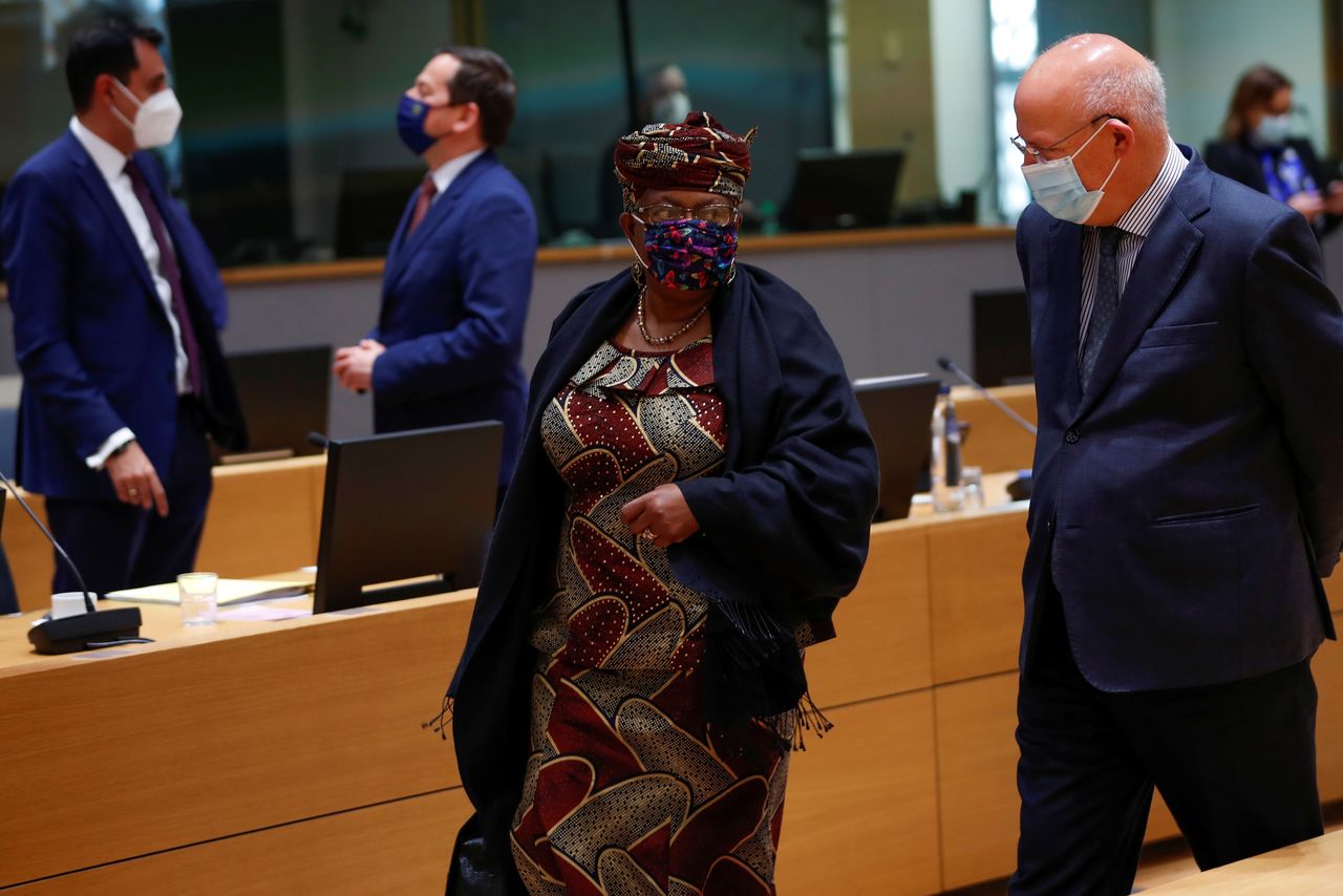 World Trade Organization Director-General Ngozi Okonjo-Iweala, left, talks to Portugal