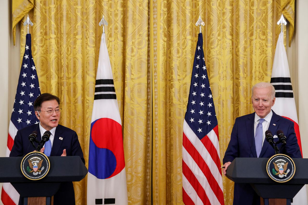 U.S. President Joe Biden reacts as South Korea