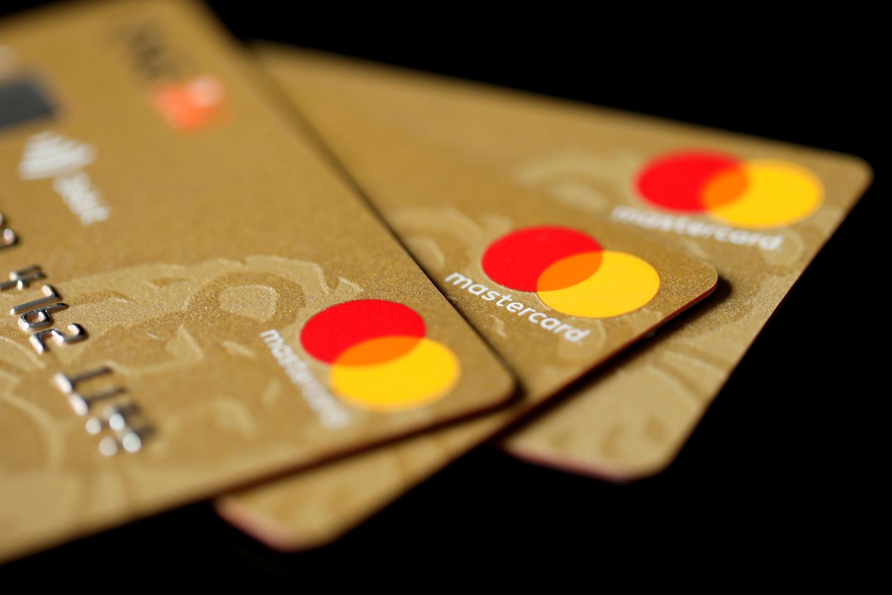 FILE PHOTO: Mastercard Inc. credit cards are displayed in this picture illustration taken December 8, 2017. REUTERS/Benoit Tessier/Illustration//File Photo