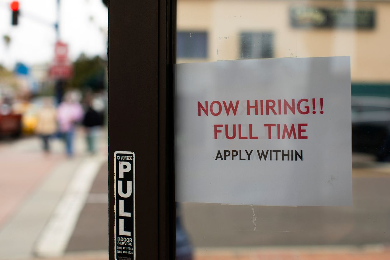 FILE PHOTO: A retail store advertising a full time job on its open door in Oceanside, California, U.S., May 10, 2021. REUTERS/Mike Blake/File Photo