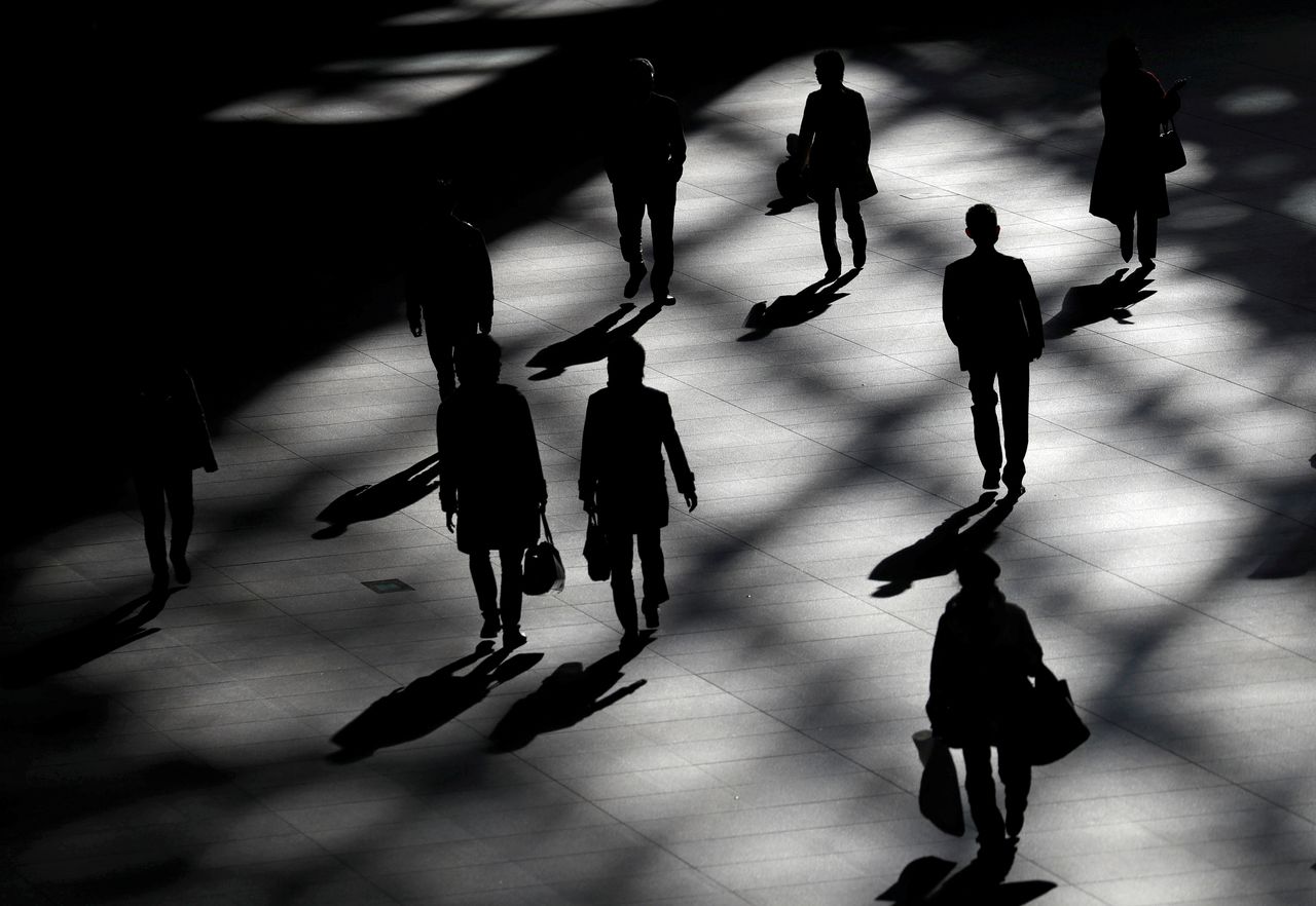 FILE PHOTO: People walk inside a building in Tokyo, Japan January 23, 2019. REUTERS/Issei Kato
