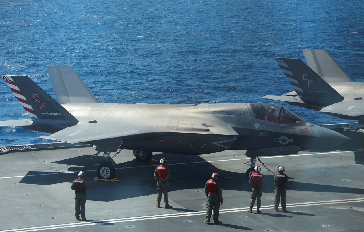 F-35B Lightning II aircrafts are seen on the deck of the HMS Queen Elizabeth aircraft carrier offshore Portugal, May 27, 2021. Picture taken through the window. REUTERS/Bart Biesemans