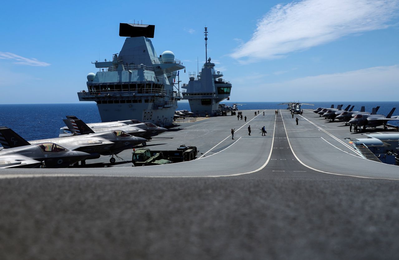 F-35B Lightning II aircrafts are seen on the deck of the HMS Queen Elizabeth aircraft carrier offshore Portugal, May 27, 2021. Picture taken through the window. REUTERS/Bart Biesemans