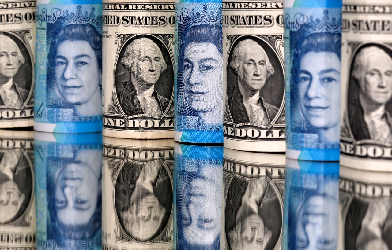 FILE PHOTO: Pound and U.S. dollar bills are seen in this illustration taken January 6, 2020. REUTERS/Dado Ruvic/Illustration