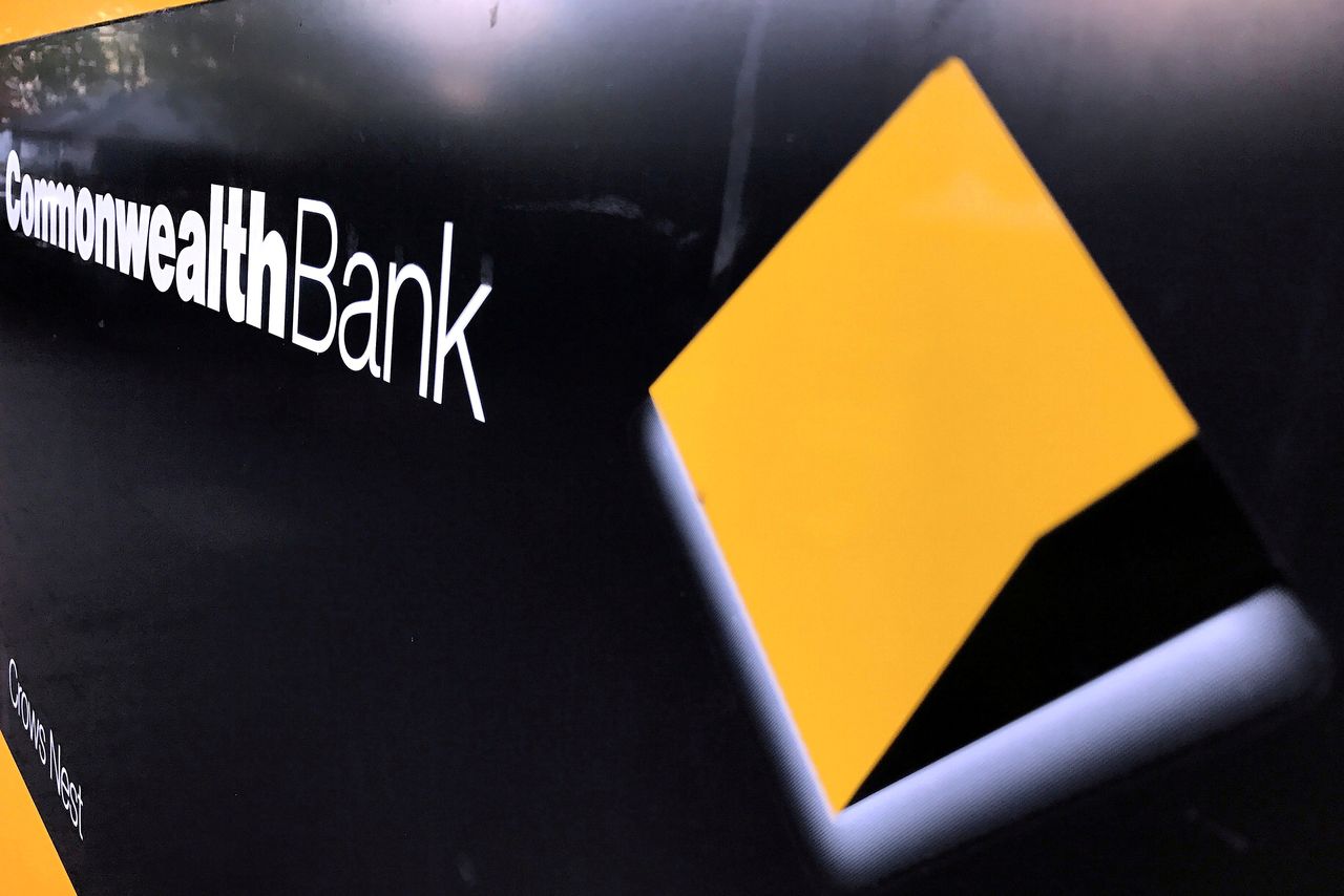 FILE PHOTO: A Commonwealth Bank of Australia logo adorns the wall of a branch in Sydney, Australia, May 8, 2017. REUTERS/David Gray