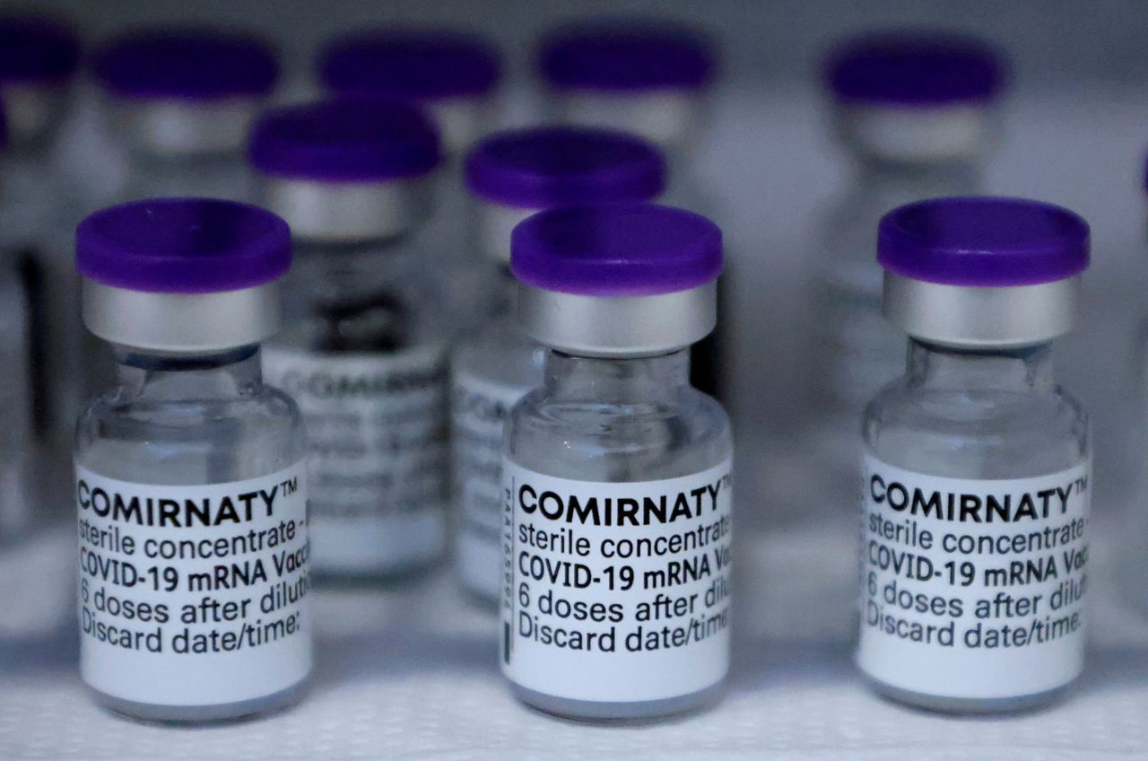 FILE PHOTO: Vials of the Pfizer-BioNTech Comirnaty coronavirus disease (COVID-19) vaccine are pictured in a General practitioners practice in Berlin, Germany, April 10, 2021. REUTERS/Fabrizio Bensch/File Photo