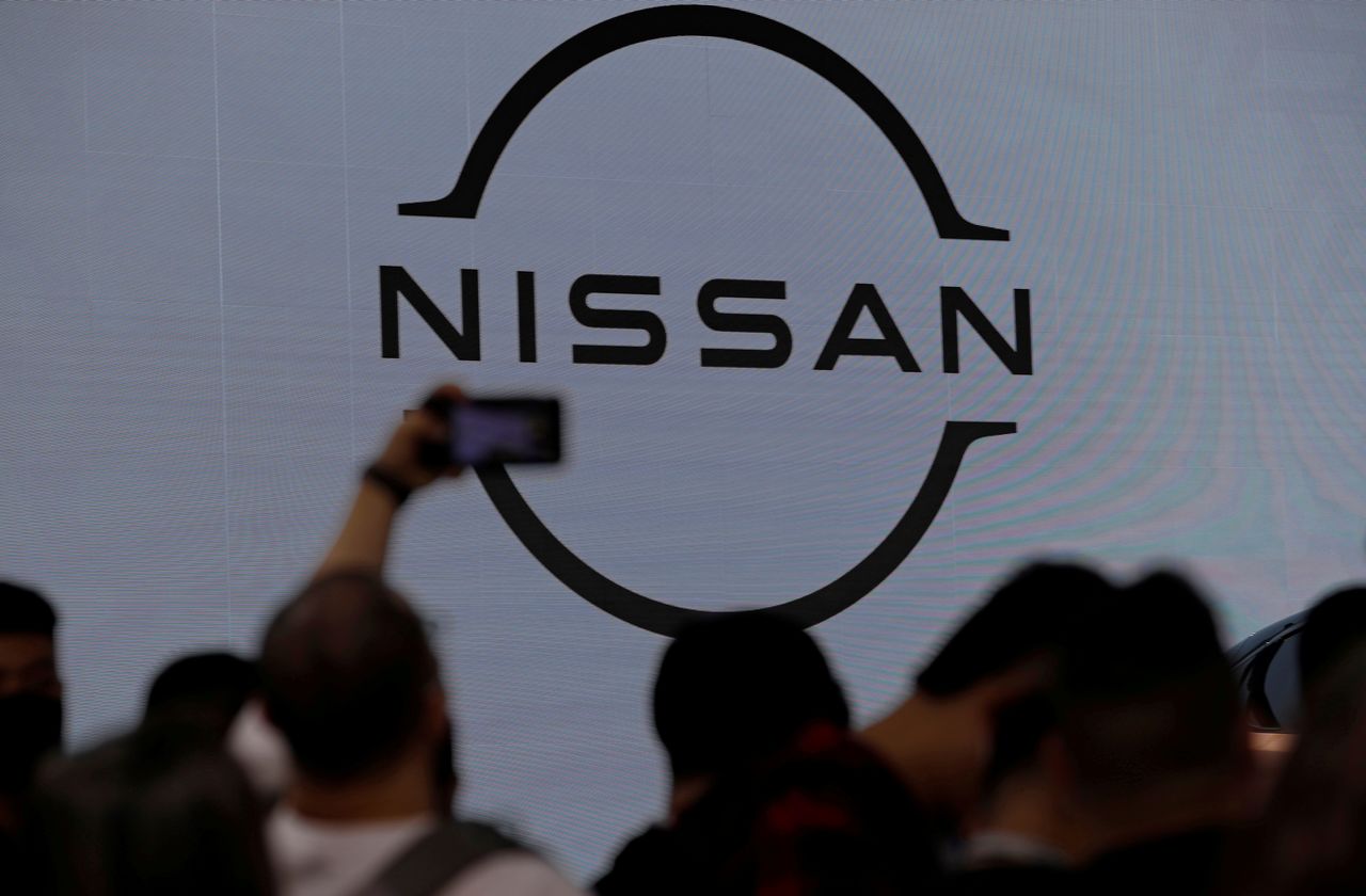 FILE PHOTO: People visit the Nissan booth at the Beijing International Automotive Exhibition, or Auto China show, in Beijing, China September 26, 2020. REUTERS/Thomas Peter