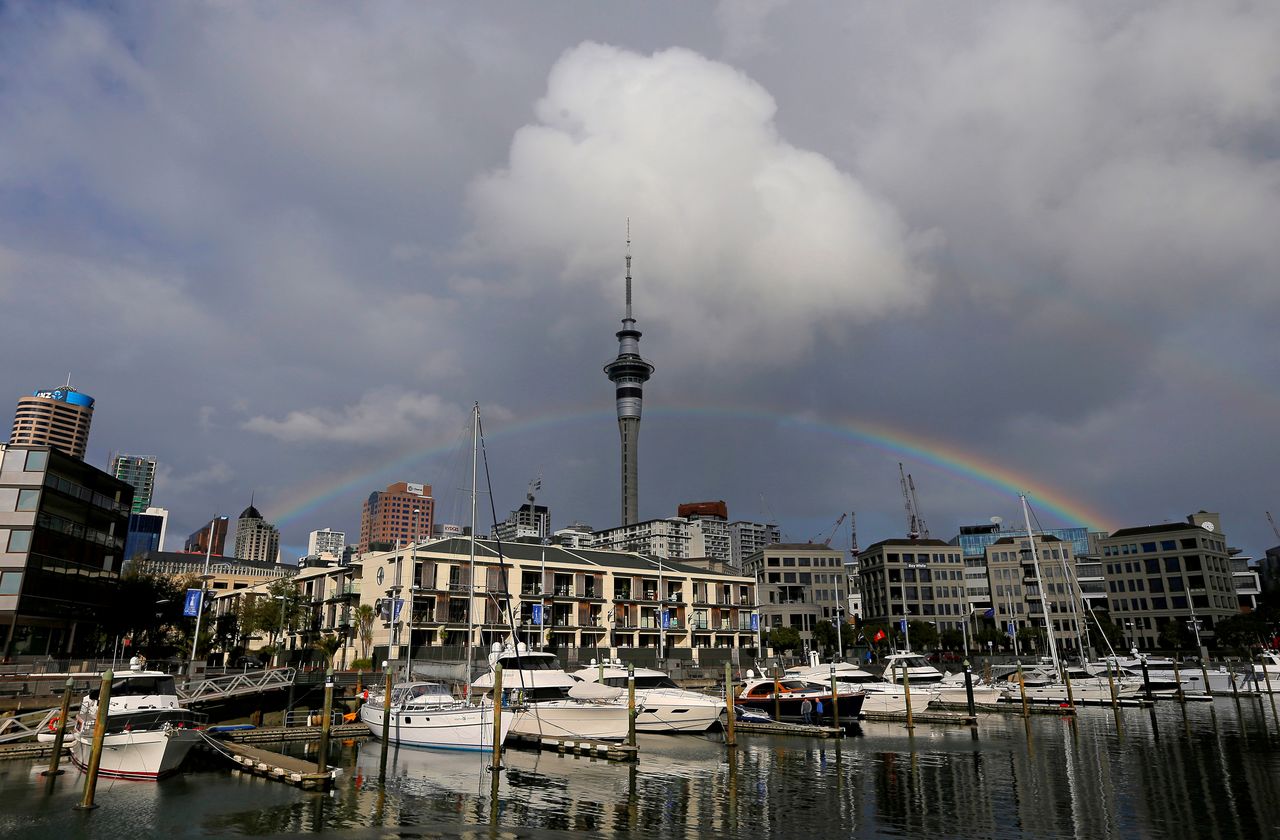FILE PHOTO: A rainbow appears on the Auckland skyline featuring Sky Tower in New Zealand, July 8, 2017. REUTERS/Jason Reed/File Photo
