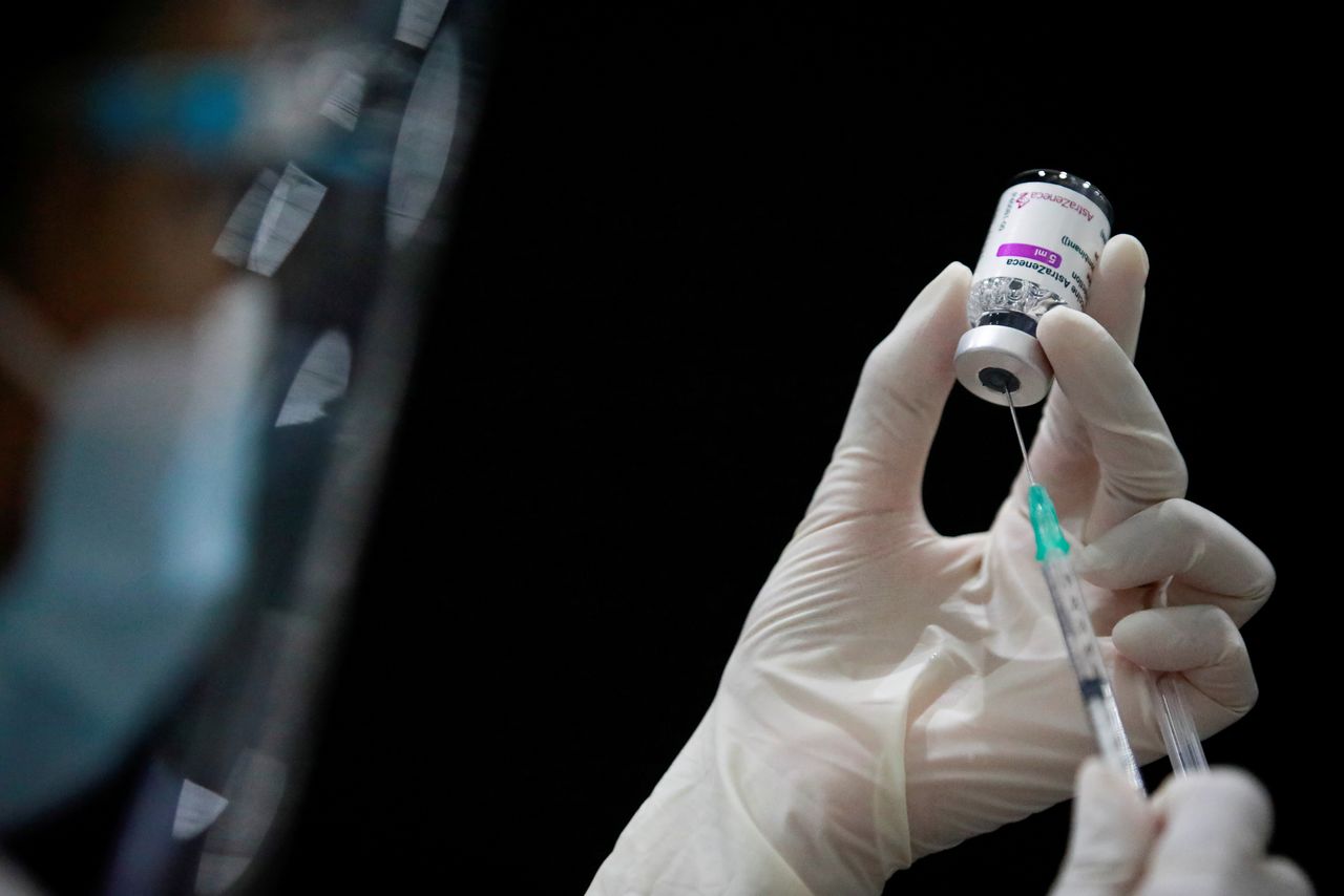 FILE PHOTO: A health worker prepares a dose of AstraZeneca COVID-19 vaccine against the coronavirus disease (COVID-19) as Thailand start mass inoculation at a gymnasium inside Siam Paragon shopping centre, Bangkok, Thailand June 7, 2021. REUTERS/Soe Zeya Tun