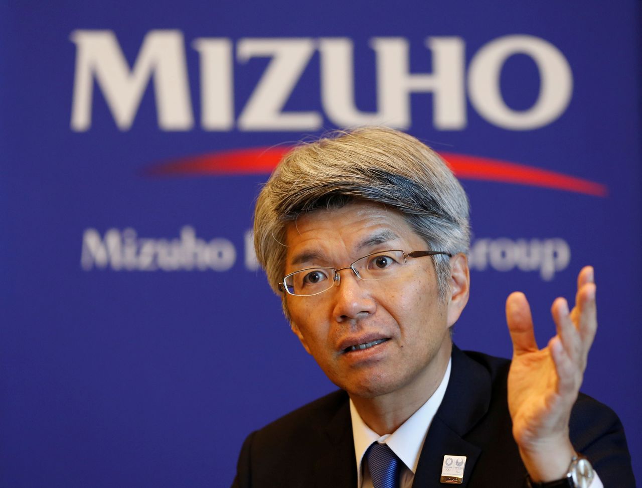 FILE PHOTO: Koji Fujiwara, President and CEO of Mizuho Bank, core banking unit of Mizuho Financial Group, attends an interview with Reuters at the bank