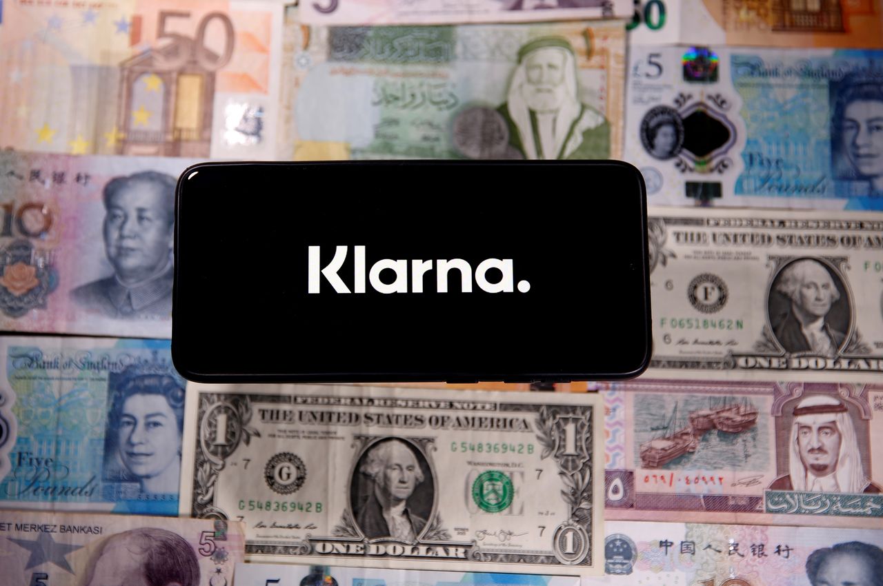 FILE PHOTO: A smartphone displays a Klarna logo on top of banknotes is in this illustration taken January 6, 2020. REUTERS/Dado Ruvic/Illustration/File Photo