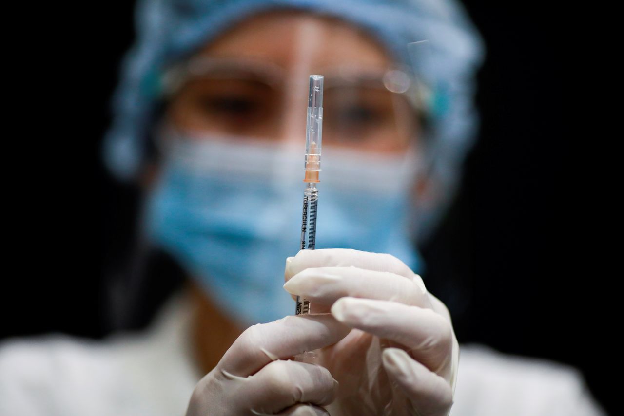 FILE PHOTO: A health worker prepares a dose of AstraZeneca COVID-19 vaccine against the coronavirus disease (COVID-19) as Thailand start a mass inoculation at a gymnasium inside the Siam paragon Shopping center, Bangkok, Thailand June 7, 2021. REUTERS/Soe Zeya Tun