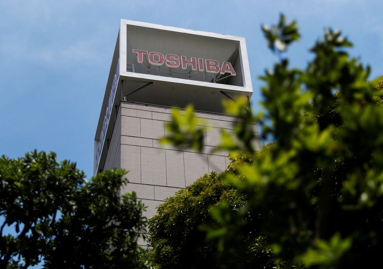 The logo of Toshiba Corp. is displayed atop of a building in Tokyo, Japan June 11, 2021. REUTERS/Issei Kato