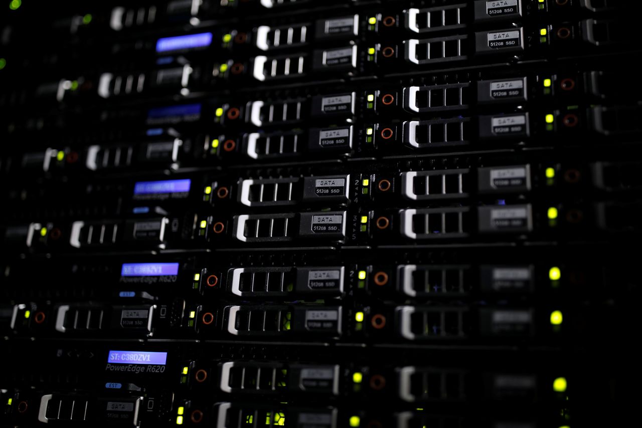 FILE PHOTO: Lights illuminate rack servers inside the data center of Equinix in Pantin, outside Paris, France, December 7, 2016. REUTERS/Benoit Tessier
