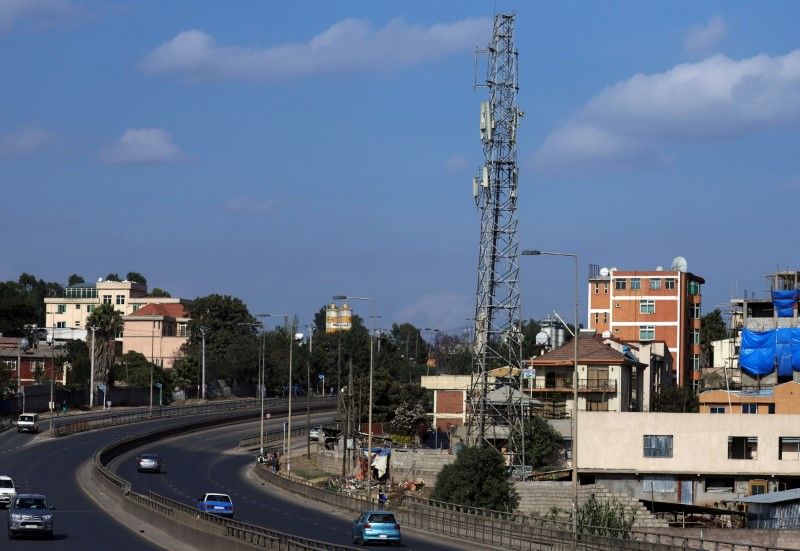 FILE PHOTO: Motorists drive past an Ethio-Telecom network tower in Addis Ababa, Ethiopia, November 12, 2019. REUTERS/Tiksa Negeri/File Photo