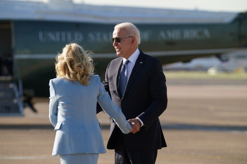 U.S. President Joe Biden and first lady Jill Biden hold hands before he departs Heathrow Airport on his way to Belgium, in London, Britain, June 13, 2021. REUTERS/Kevin Lamarque