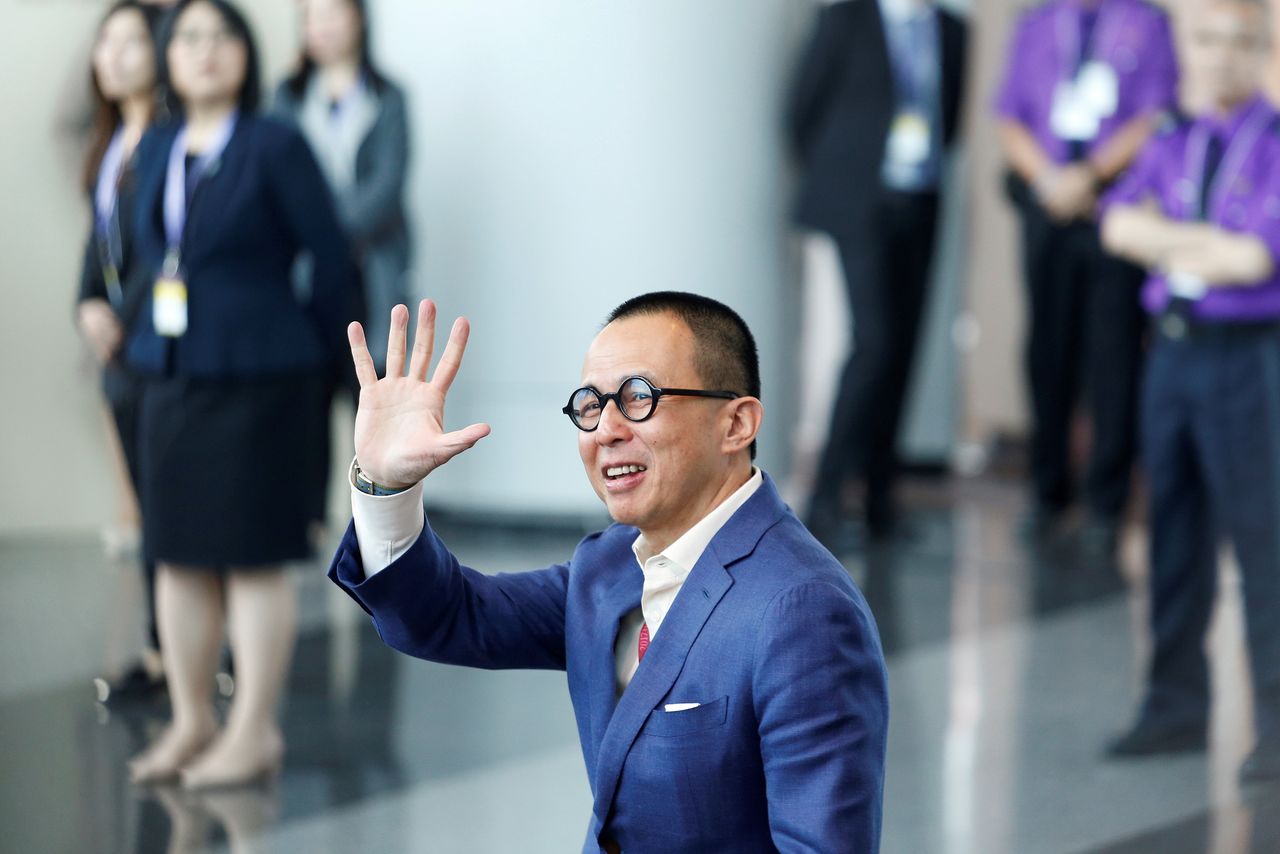 FILE PHOTO: Richard Li, Hong Kong businessman and younger son of tycoon Li Ka-shing, waves as he arrives to vote during the election for Hong Kong