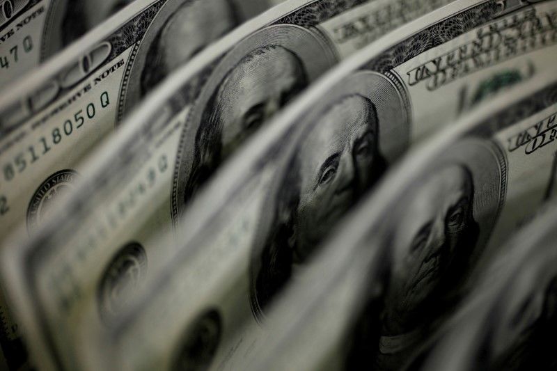 FILE PHOTO: A picture illustration shows U.S. 100-dollar bank notes taken in Tokyo August 2, 2011. REUTERS/Yuriko Nakao