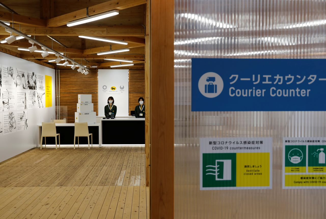 A courier counter at the village plaza of the Tokyo 2020 Olympic and Paralympic Village is pictured in Tokyo, Japan, June 20, 2021. REUTERS/Kim Kyung-Hoon