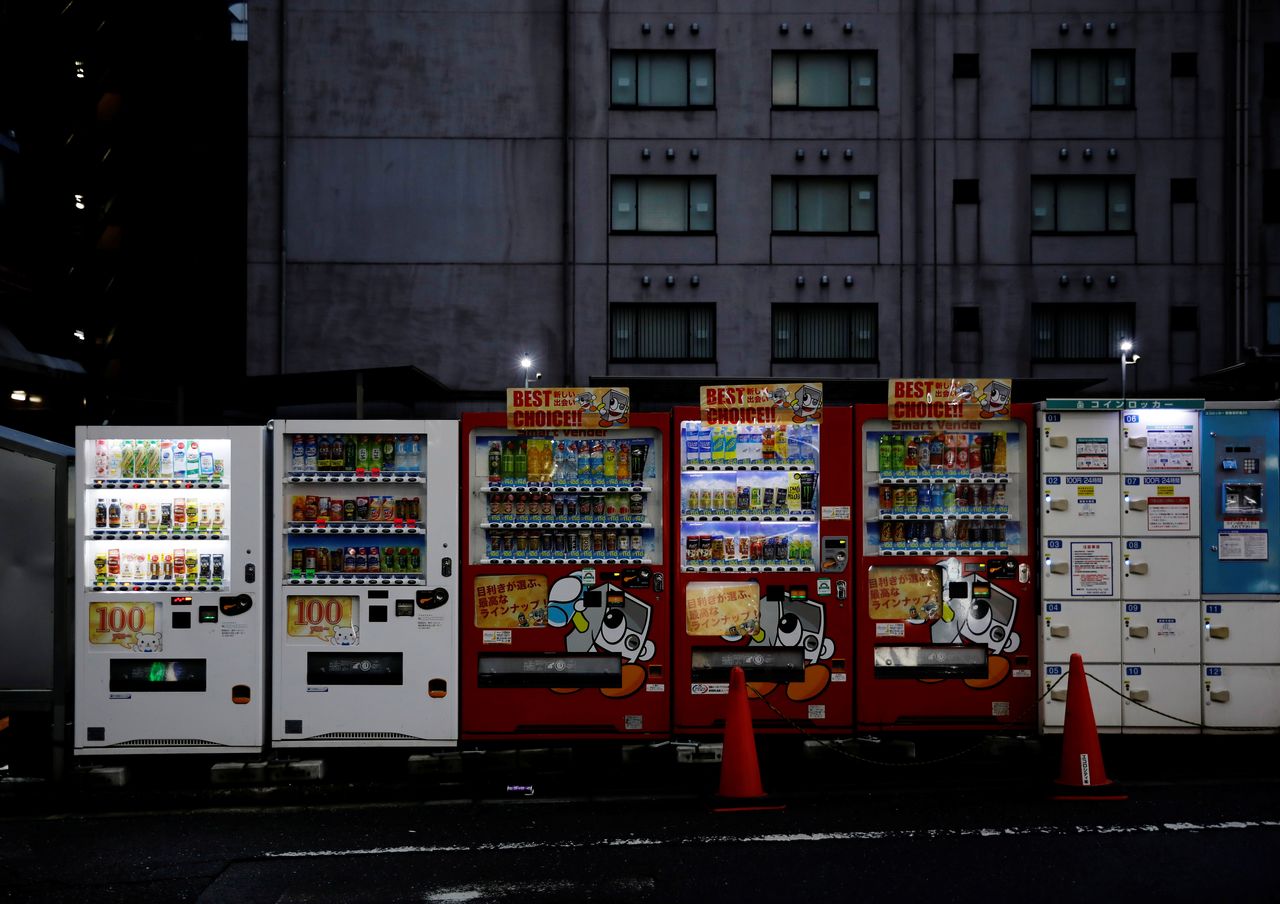 Vending machines stand in Shinjuku, Tokyo, Japan, June 16, 2021. REUTERS/Kim Kyung-Hoon