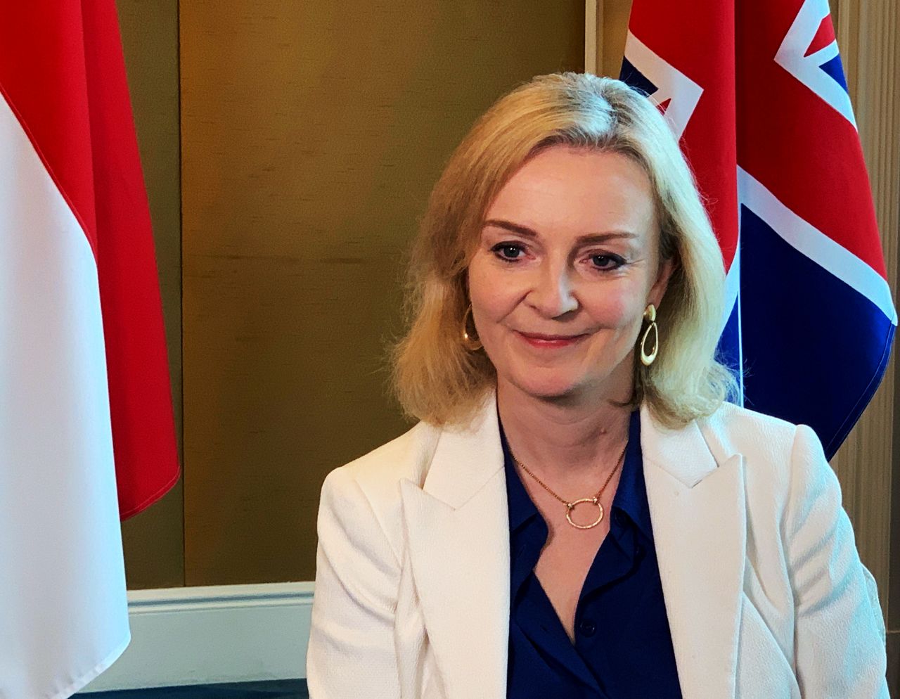 FILE PHOTO: British trade minister Liz Truss speaks to Reuters after signing a free trade agreement with Singapore, in Singapore December 10, 2020. REUTERS/Pedja Stanisic/File Photo