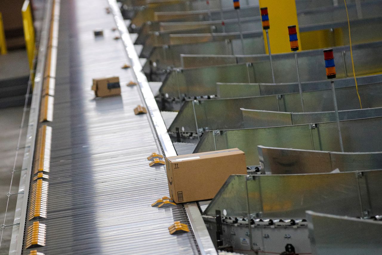 FILE PHOTO: Packages are transported on a sorting machine inside Amazon