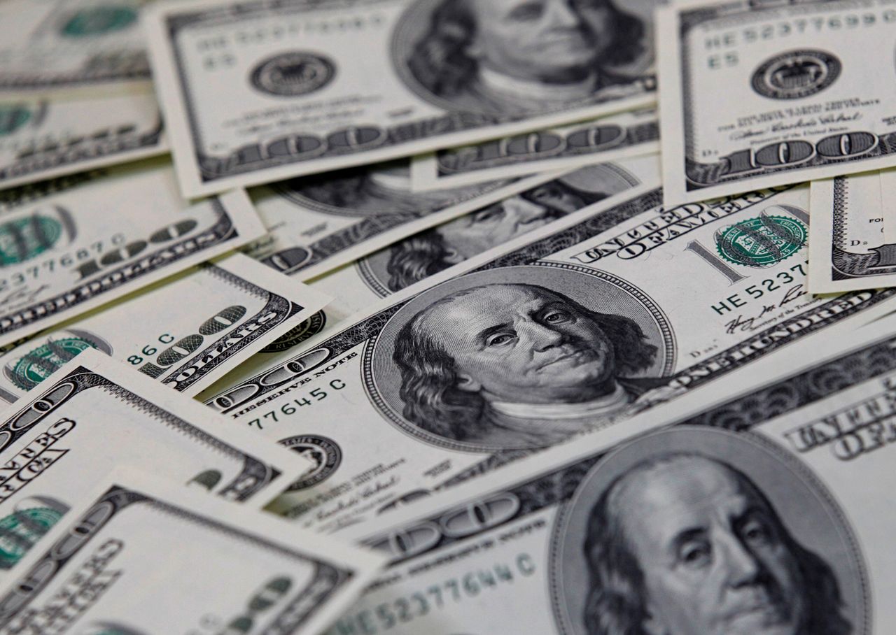 FILE PHOTO: U.S. one hundred dollar notes are seen in this picture illustration taken in Seoul February 7, 2011. REUTERS/Lee Jae-Won/File Photo