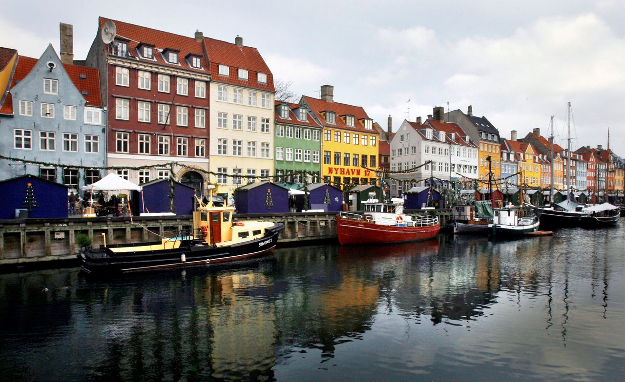 FILE PHOTO: Boats are seen anchored at the 17th century Nyhavn district, home to many shops and restaurants in Copenhagen, Denmark, December 5, 2009. REUTERS/Bob Strong/File Photo
