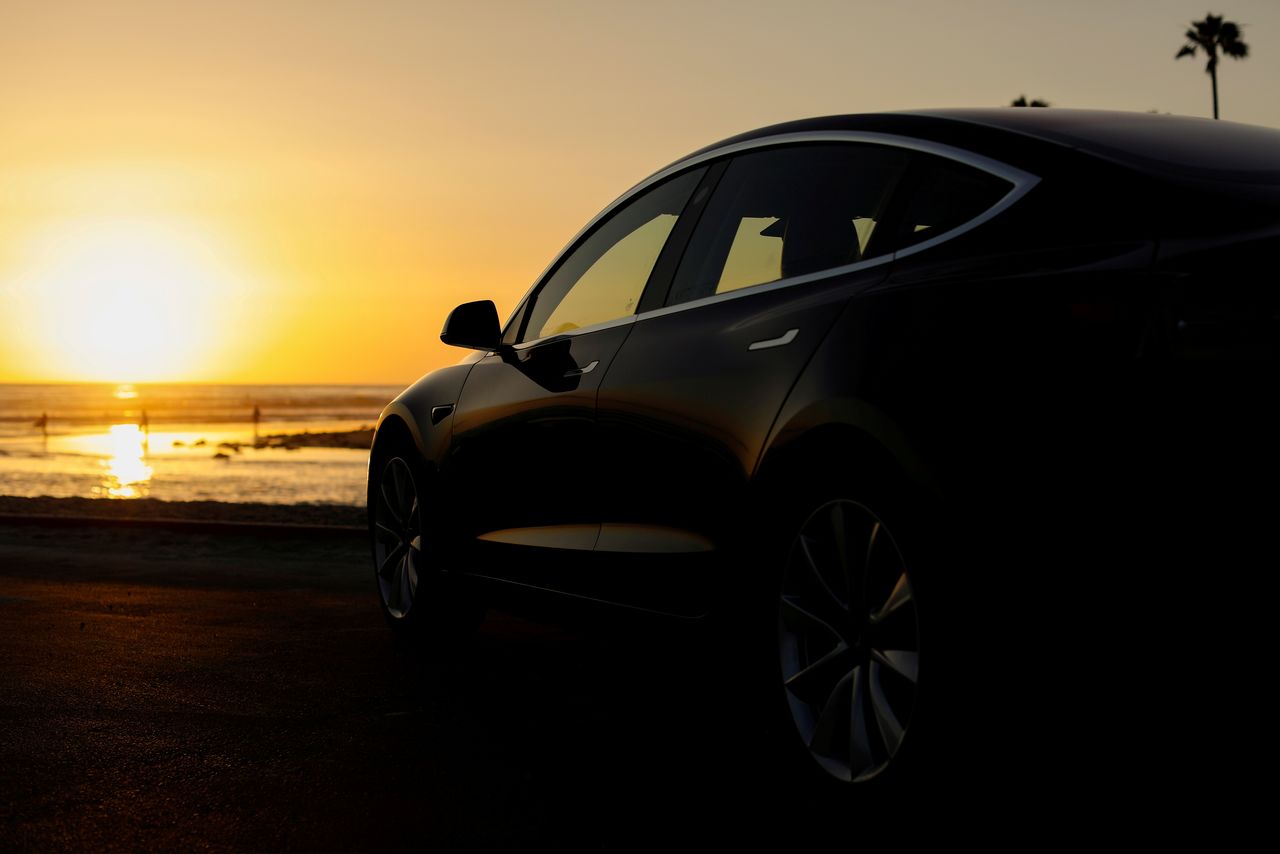 FILE PHOTO: A 2018 Tesla Model 3 electric vehicle is shown in this photo illustration taken in Cardiff, California, U.S., June 1, 2018. REUTERS/Mike Blake/File Photo