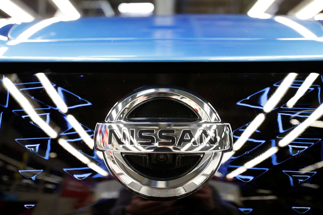 The logo of Nissan is seen on a car ahead of a news conference at Nissan