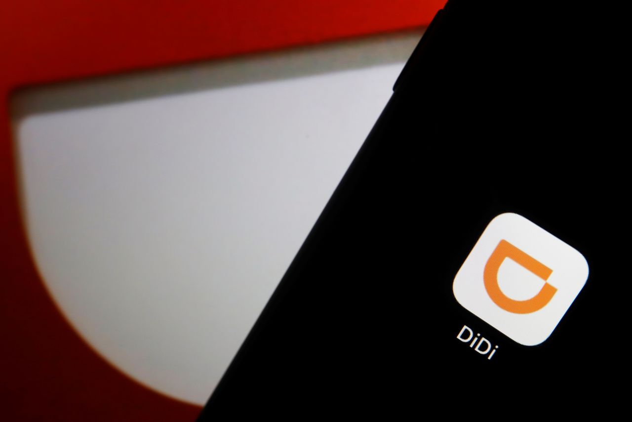 FILE PHOTO: The app logo of Chinese ride-hailing giant Didi is seen on a mobile phone in this illustration picture taken July 1, 2021. REUTERS/Florence Lo/Illustration