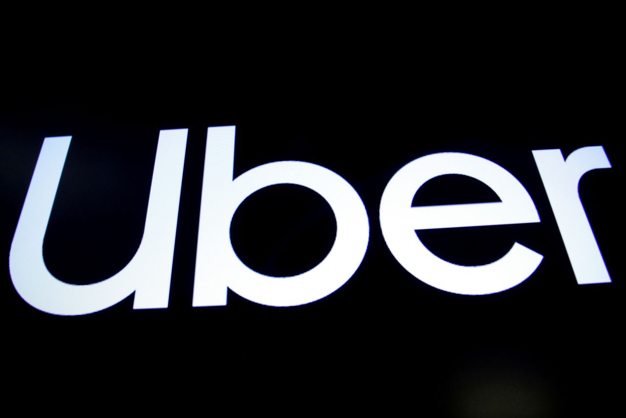 FILE PHOTO: A screen displays the company logo for Uber Technologies Inc. on the day of it