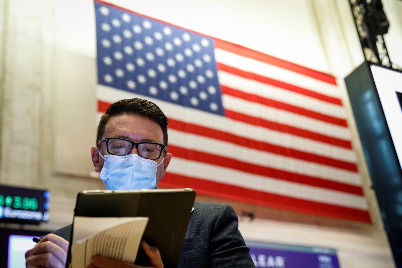 FILE PHOTO: A trader works on the floor of the New York Stock Exchange (NYSE) in New York City, U.S., June 30, 2021. REUTERS/Brendan McDermid