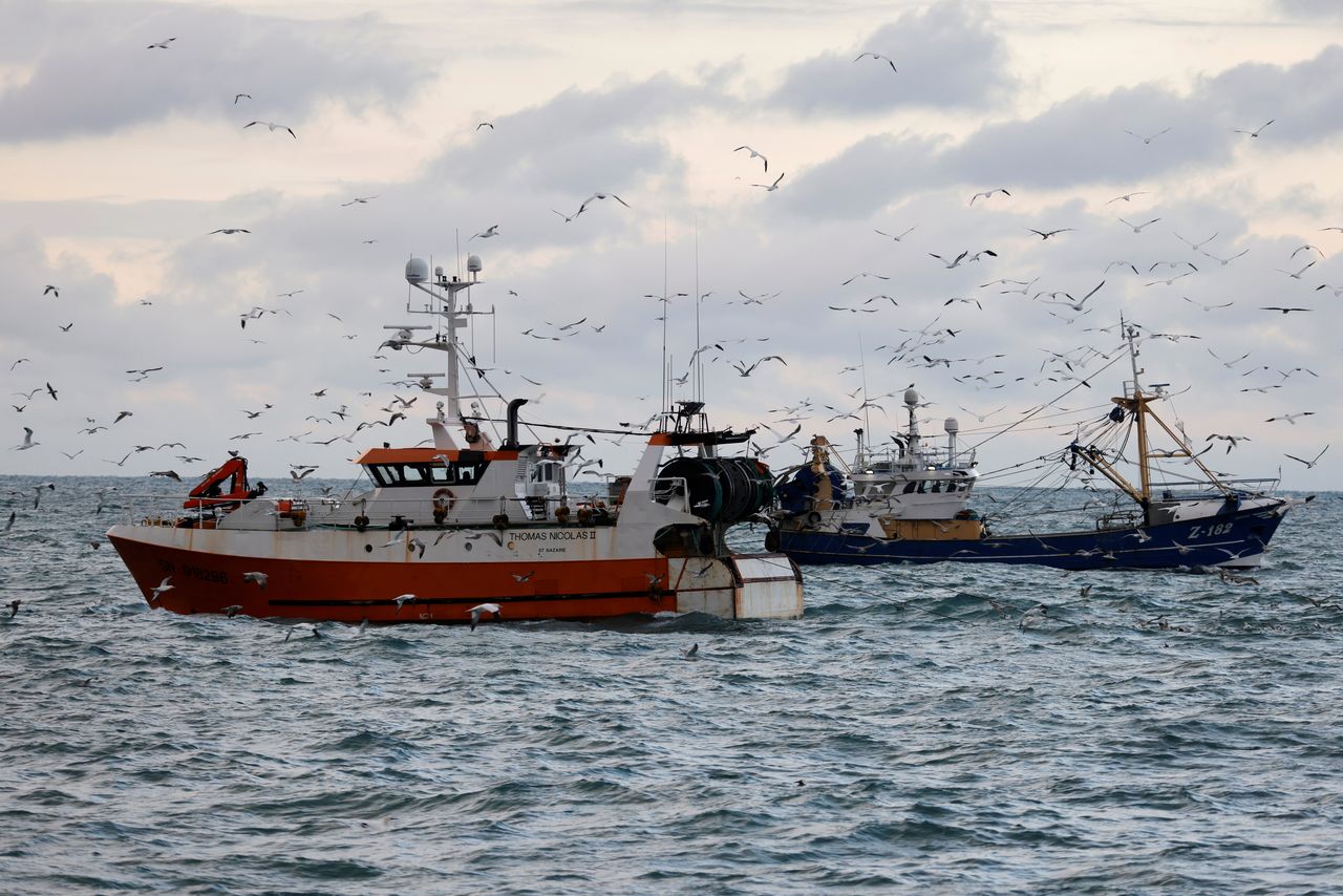 FILE PHOTO: The French trawler "Thomas Nicolas II" sails past a Dutch trawler in the North Sea, off the coast of northern France, December 7, 2020. Picture taken with a drone December 7, 2020. REUTERS/Pascal Rossignol/File Photo