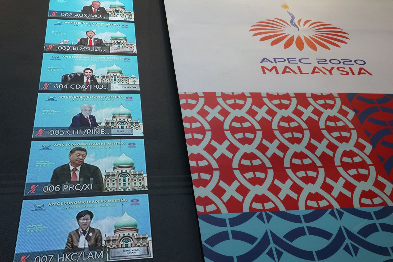 FILE PHOTO: Participants of the virtual APEC Economic Leaders Meeting 2020 are seen on a screen, in Kuala Lumpur, Malaysia November 20, 2020. REUTERS/Lim Huey Teng/File Photo