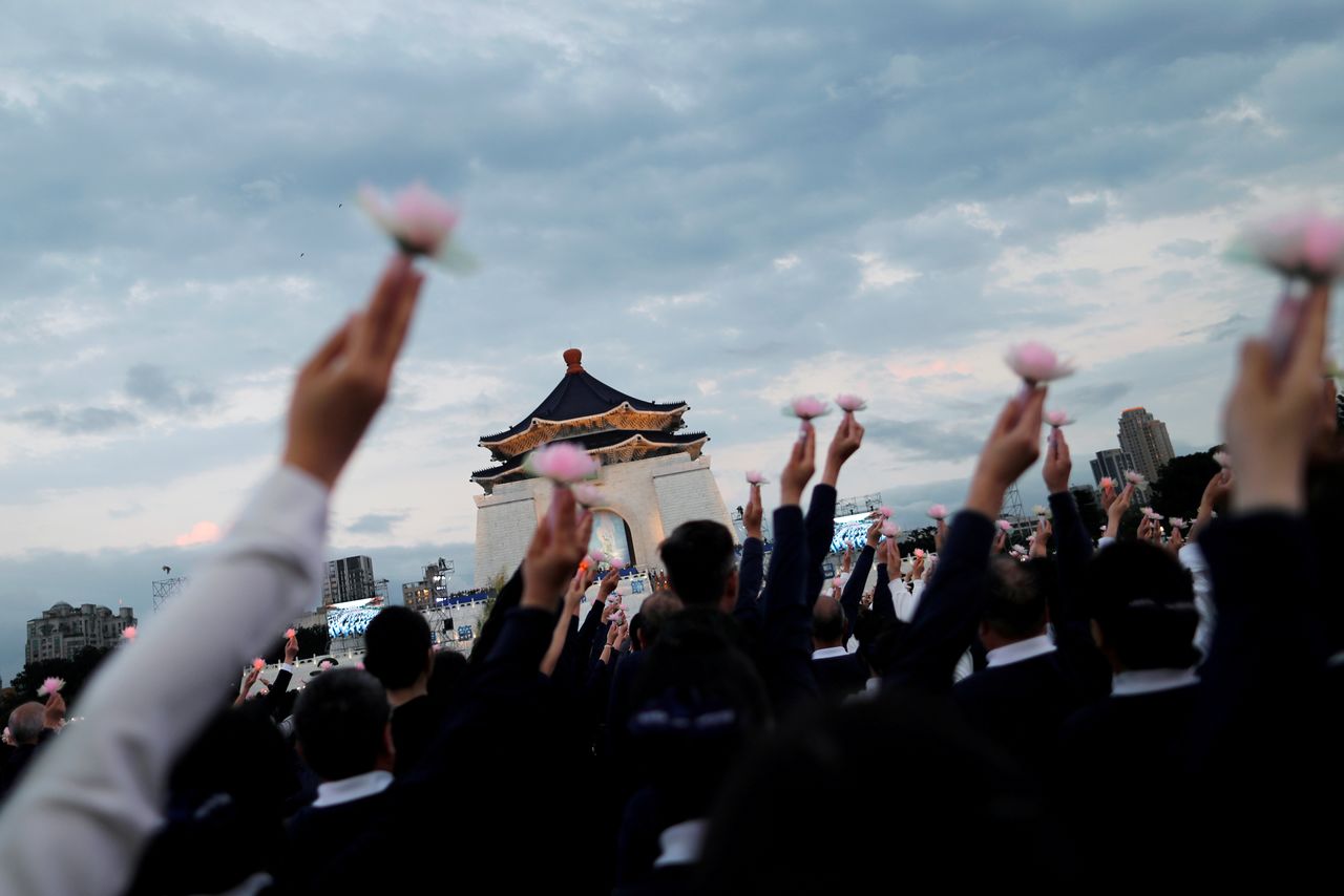 Members of the Buddhist Tzu Chi Foundation pray during a ceremony to commemorate the birth of Buddha, at the Liberty Square in Taipei, Taiwan May 12, 2019. REUTERS/Tyrone Siu TPX IMAGES OF THE DAY