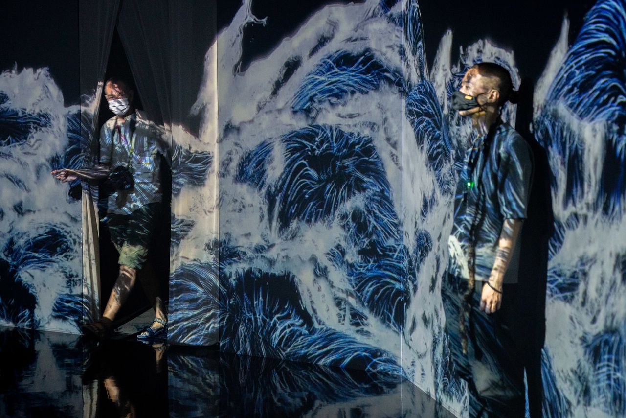 Jul 21, 2021; Tokyo, Japan; Members of the media tour the teamLab Borderless immersive digital art museum before the Tokyo 2020 Summer Olympic Games. Mandatory Credit: Andrew Nelles-USA TODAY Network