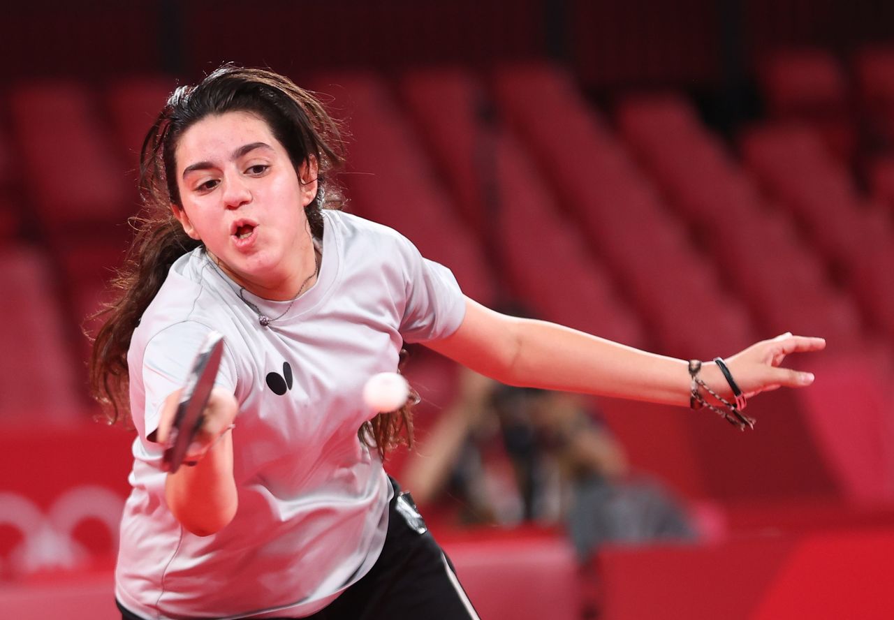 Tokyo 2020 Olympics - Table Tennis - Women's Singles - Preliminary Round - Tokyo Metropolitan Gymnasium - Tokyo, Japan - July 24, 2021. Hend Zaza of Syria in action against Jia Liu of Austria REUTERS/Luisa Gonzalez
