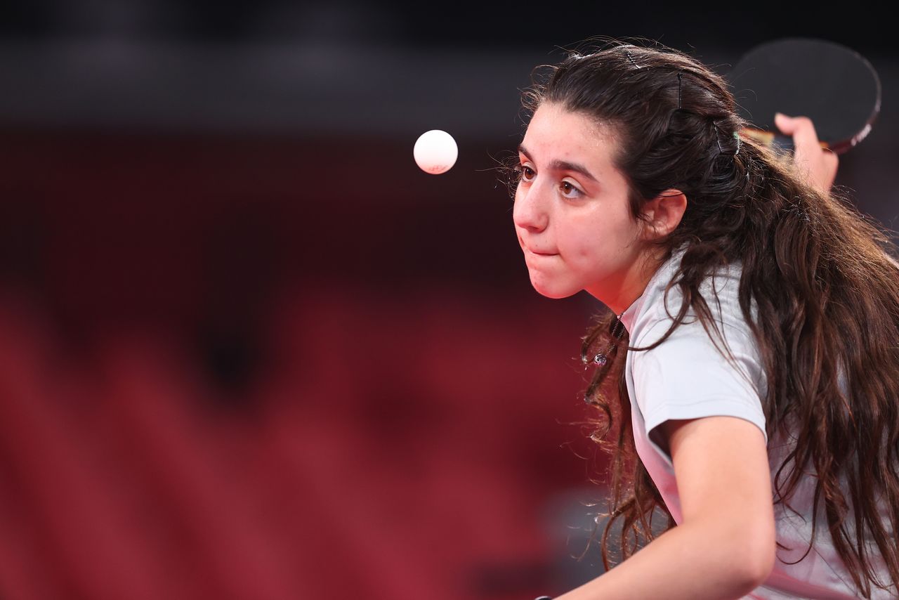 Tokyo 2020 Olympics - Table Tennis - Women's Singles - Preliminary Round - Tokyo Metropolitan Gymnasium - Tokyo, Japan - July 24, 2021. Hend Zaza of Syria in action against Jia Liu of Austria REUTERS/Luisa Gonzalez