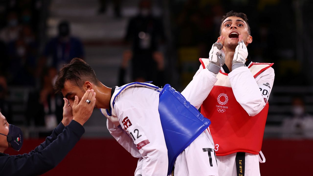 Tokyo 2020 Olympics - Taekwondo - Men's Flyweight - 58kg - Gold medal match - Makuhari Messe Hall A, Chiba, Japan - July 24, 2021. Vito Dell'aquila of Italy and Mohamed Khalil Jendoubi of Tunisia react after competing REUTERS/Murad Sezer