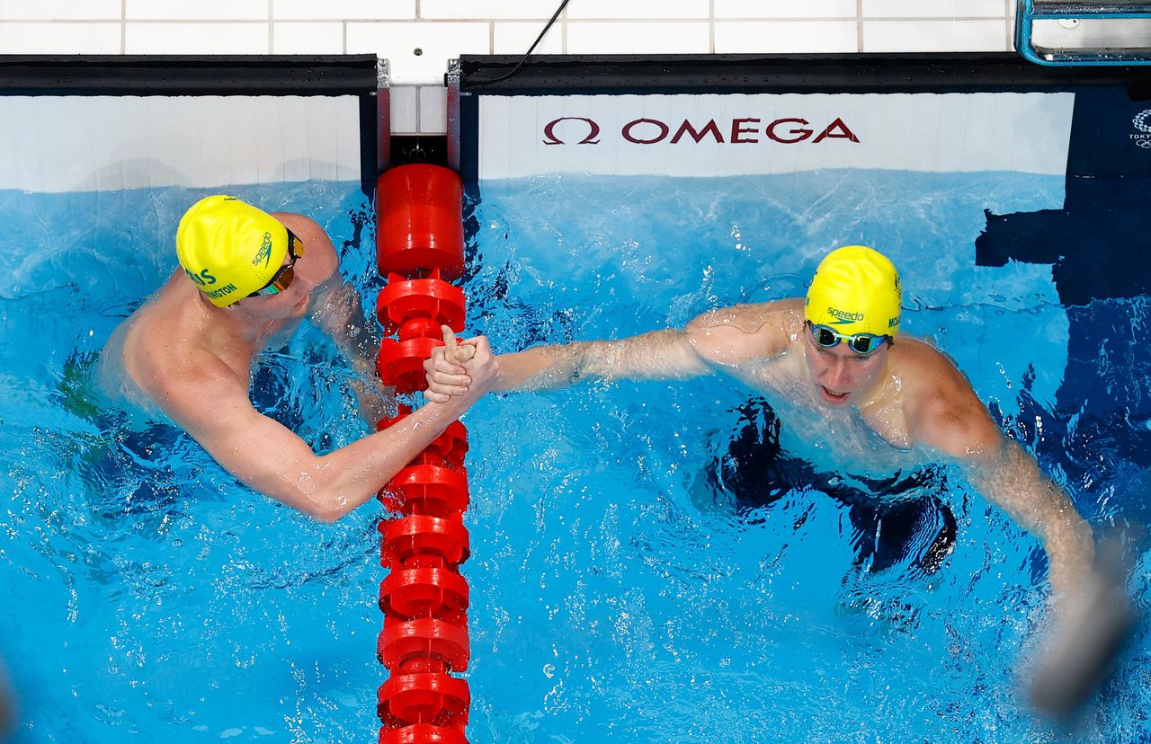 Tokyo 2020 Olympics - Swimming - Men's 400m Freestyle - Heats - Tokyo Aquatics Centre - Tokyo, Japan - July 24, 2021. Elijah Winnington of Australia and Jack McLoughlin of Australia react REUTERS/Antonio Bronic