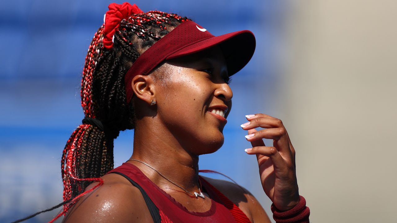 Tokyo 2020 Olympics - Tennis - Women's Singles - Round 1 - Ariake Tennis Park - Tokyo, Japan - July 25, 2021. Naomi Osaka of Japan celebrates after winning her first round match against Zheng Saisai of China REUTERS/Edgar Su