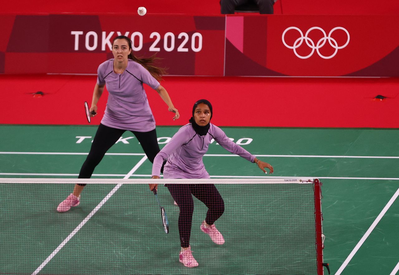 Tokyo 2020 Olympics - Badminton - Women's Doubles - Group Stage - MFS - Musashino Forest Sport Plaza, Tokyo, Japan - July 24, 2021. Doha Hany of Egypt and Hadia Hosny of Egypt in action during the match against Mayu Matsumoto of Japan and Wakana Nagahara of Japan. REUTERS/Leonhard Foeger