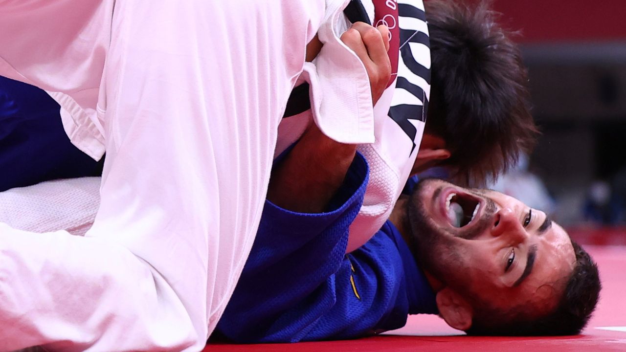 Tokyo 2020 Olympics - Judo - Men's 66kg - Gold medal match - Nippon Budokan - Tokyo, Japan - July 25, 2021. Hifumi Abe of Japan in action against Vazha Margvelashvili of Georgia REUTERS/Sergio Perez