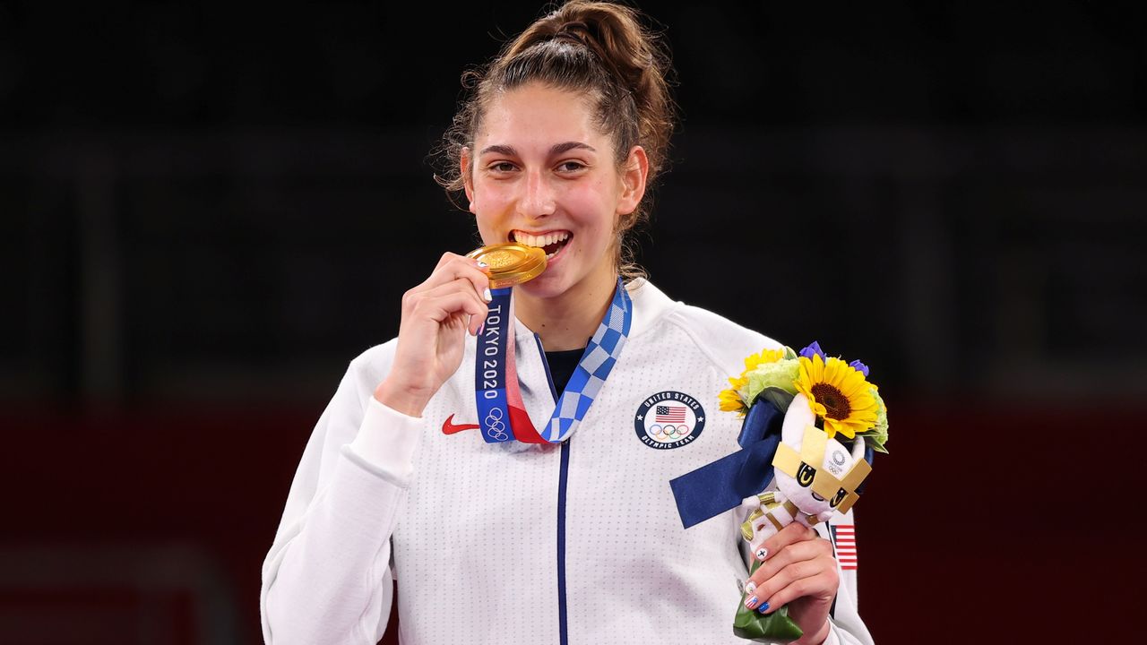 Tokyo 2020 Olympics - Taekwondo - Women's Featherweight 49-57kg - Medal Ceremony - Makuhari Messe Hall A, Chiba, Japan - July 25, 2021. Anastasija Zolotic of the United States celebrates winning gold REUTERS/Murad Sezer
