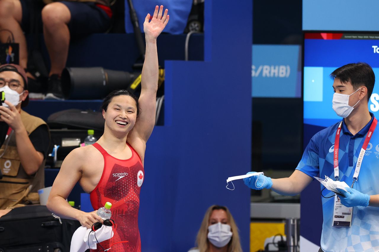 Tokyo 2020 Olympics - Swimming - Women's 100m Butterfly - Final - Tokyo Aquatics Centre - Tokyo, Japan - July 26, 2021. Margaret MacNeil of Canada celebrates after winning the gold medal REUTERS/Marko Djurica